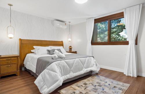 Bairro Lago Negro Apartamento | Apartamento Grunerberg 3 Suítes by Achei Gramado