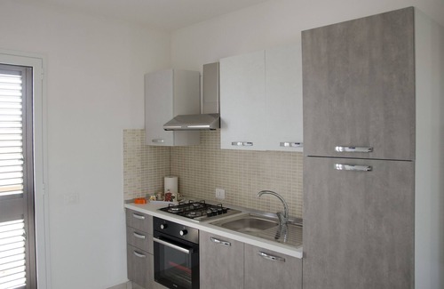 Fondo Morte Apartamento | Apartamento 'Dolce Vita Marzamemi Uno' con vistas al mar, terraza compartida y aire acondicionado.