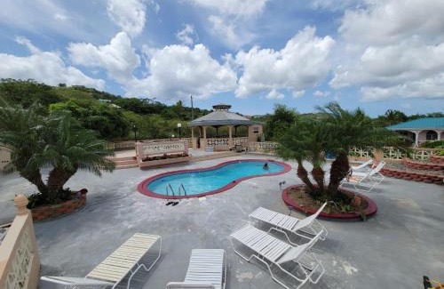 Grove Place Apartamento | Apartment in Fredriksted With Pool -Tiffany's Place at The Green Castle