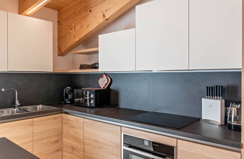 Vigo di Fassa Apartamento | Apartamento 'Majon De Rita' con vistas a la montaña, bañera de hidromasaje y Wi-Fi