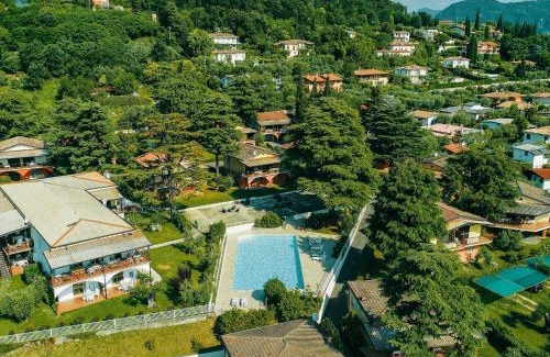 Villaggio Sanghen Casa | Apartment on Lake Garda with pebble beach pier for boat three swimming pools