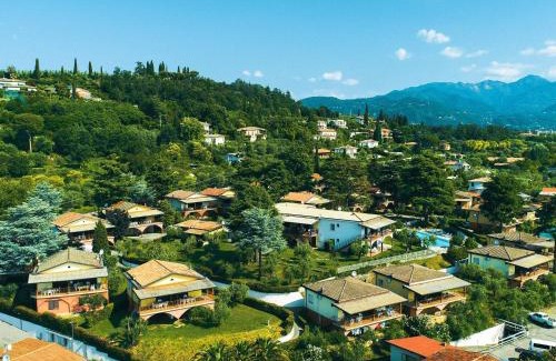 Villaggio Sanghen Casa | Apartment on Lake Garda with pebble beach pier for boat three swimming pools