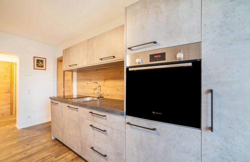 Racines Apartamento | Apartamento "Parigger Apt Enzian" con vistas a la montaña, jardín compartido y Wi-Fi