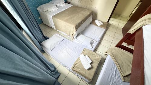 Vila Assuncao Apartamento | Ape aconchegante a 50m da Praia Tupi Wi-Fi, Smart TV e enxoval completo