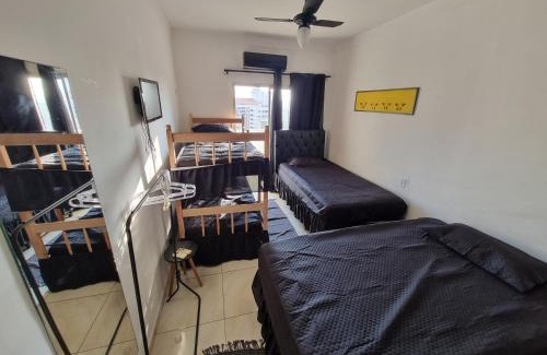 Pitangueiras Apartamento | ApMar 15a até 8 pessoas - Pitangueiras Guarujá - 2 minutos da praia - 2 quartos e 1 suíte com Ar Condicionado - 1 Vaga Garagem 24h - Próximo de mercados, bares, restaurantes
