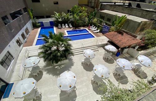 Pitangueiras Apartamento | Apto com piscinas, sacada Gourmet, 2 gar, 50 mts da praia
