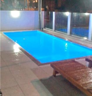 Governador Celso Ramos Apartamento | Apto na praia de Palmas, climatizado, com piscina, próximo ao mar e com jardim privativo