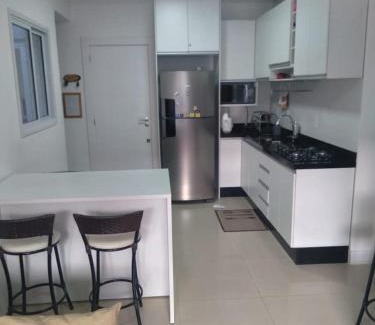 Governador Celso Ramos Apartamento | Apto na praia de Palmas, climatizado, com piscina, próximo ao mar e com jardim privativo