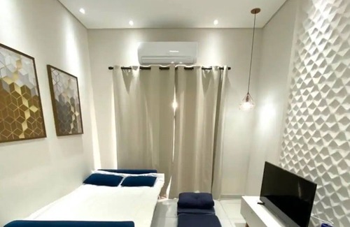 Bertioga Hotel | Apto novo e arejado com uma ampla sacada