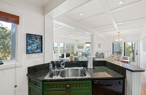 Bald Head Island Condominio | As you enter, the Bald Head Creek and marsh vistas-through the walls of windows-catch your eye.