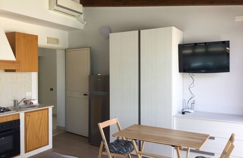 Pozzallo Apartamento | Attic, stylishly furnished, large terrace and sea view, 5 min. to the beach.