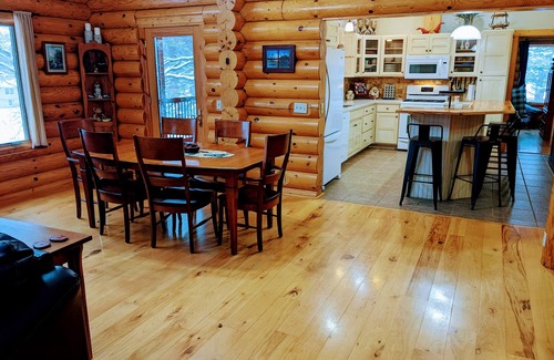 Albert Lea Casa | Happy Days Log Home and garden on Fountain Lake. Toys for all!