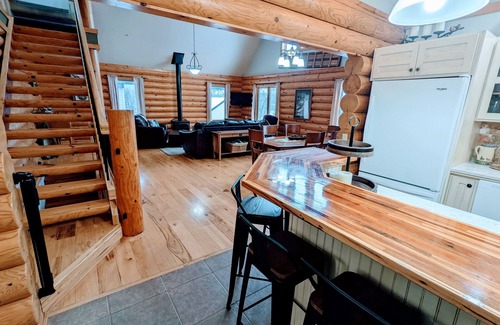 Albert Lea Casa | Happy Days Log Home and garden on Fountain Lake. Toys for all!