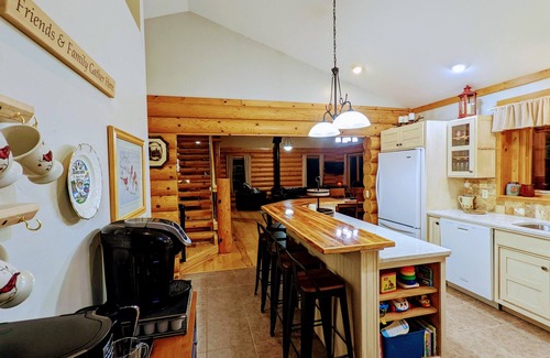 Albert Lea Casa | Happy Days Log Home and garden on Fountain Lake. Toys for all!