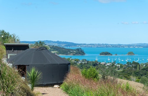 Palm Beach Cabina | Awaawa Yurts - Combined - 3 Yurt Package - Awaawa Yurts offer a luxury glamping experience on Waiheke Island. Stunning views, luxury queen sized bed, private bathroom with tea and coffee making facilities.
