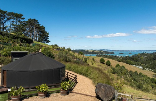 Palm Beach Cabina | Awaawa Yurts - Tane Yurt - Awaawa Yurts offer a luxury glamping experience on Waiheke Island. Stunning views, luxury queen sized bed, private bathroom with tea and coffee making facilities.