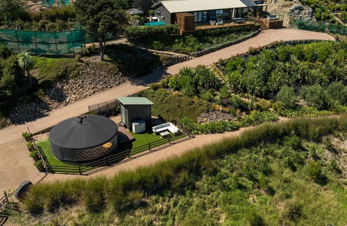 Palm Beach Cabina | Awaawa Yurts - Tane Yurt - Awaawa Yurts offer a luxury glamping experience on Waiheke Island. Stunning views, luxury queen sized bed, private bathroom with tea and coffee making facilities.