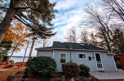 Sullivan Casa | Back of the Moon Lakefront Camp family watersports fire pit 1 dog beach sleeps 8
