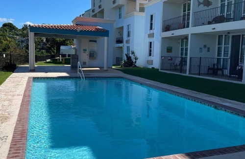 La Mela Condominio | Relax at Bahía Real – Poolside Balcony Escape