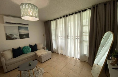 La Mela Condominio | Relax at Bahía Real – Poolside Balcony Escape