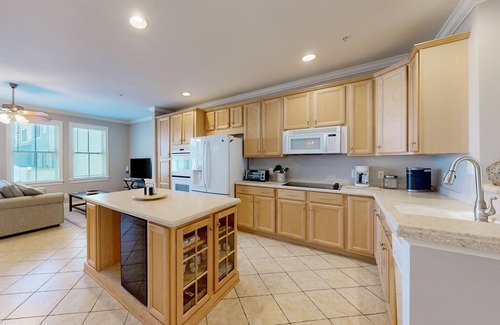 Sunset Island Casa | Bay view townhome with multiple decks, pool & gym - walk to the beach