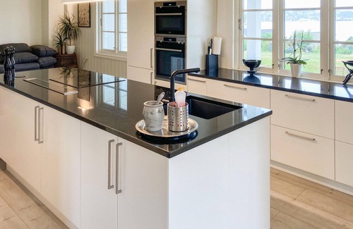 Stord Casa | Be enchanted by the magnificent view of the fjord in this vacation home.