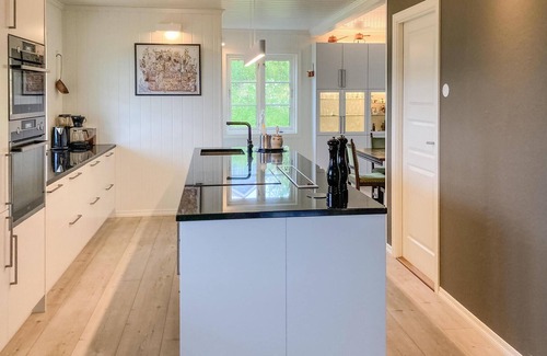 Stord Casa | Be enchanted by the magnificent view of the fjord in this vacation home.