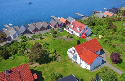 Stord Casa | Be enchanted by the magnificent view of the fjord in this vacation home.