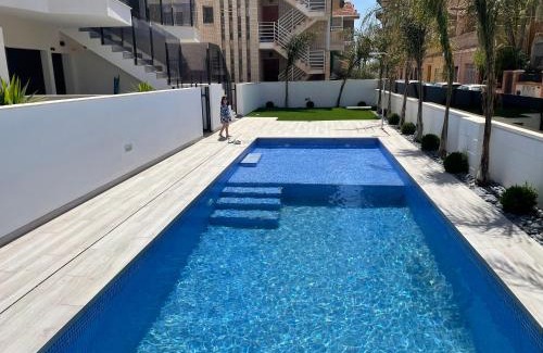 Santiago de la Ribera Apartamento | Beach bungalow with swiming pool and long terrace