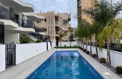 Santiago de la Ribera Apartamento | Beach bungalow with swiming pool and long terrace