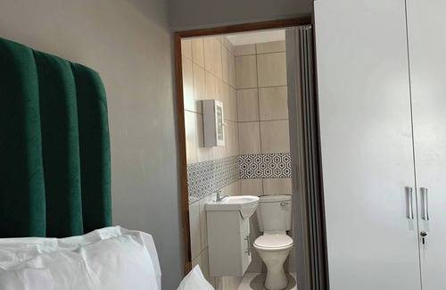 Motherwell Cama Y Desayuno | Vista a la playa, dormitorio en suite