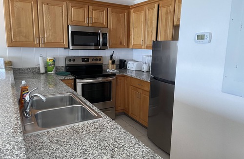 Colliers Bay Condominio | Condominio en el primer piso frente a la playa - ¡Sal de tu patio y entra al paraíso!