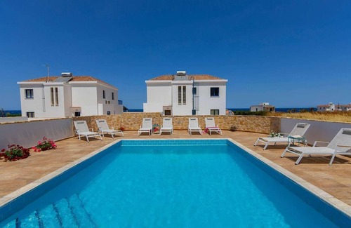 Pomos Villa | Beachfront 4 bed villa with sea views.