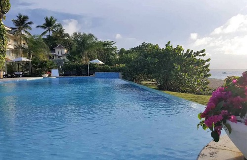 Playa Chiquita Apartamento | Beachfront condo in downtown Sosua, guest-friendly, sea views