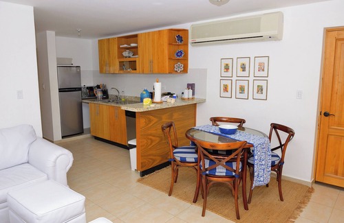 Dominicus Condominio | Beachfront Bliss: Cozy 2-Bedroom Rental Sleeps 4-6 with the sand 10 meters away