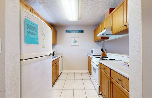 Sugar Beach Casa | Beachfront townhome w/ on-site beach access, heated pool, patio, grill, AC, W/D