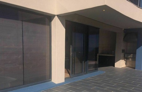 Gansbaai Apartamento | Acogedor apartamento para 4 personas con WIFI, piscina, TV, terraza y aparcamiento