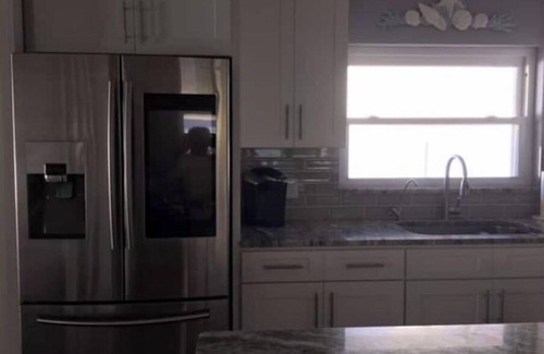 Neptune Beach Casa | Beautiful Coastal Beach Home - 2 min walk to Beach- 4 bedroom 3 bath 2 masters!