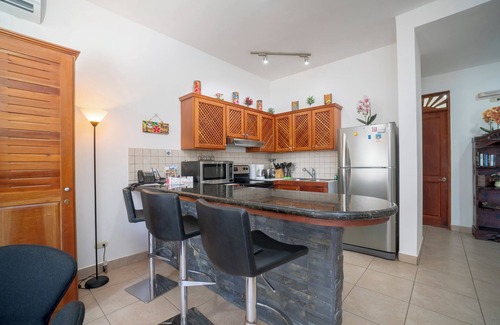 Cerro Plano Condominio | Beautiful Condo garden and pool views, a few steps from Jaco Beach