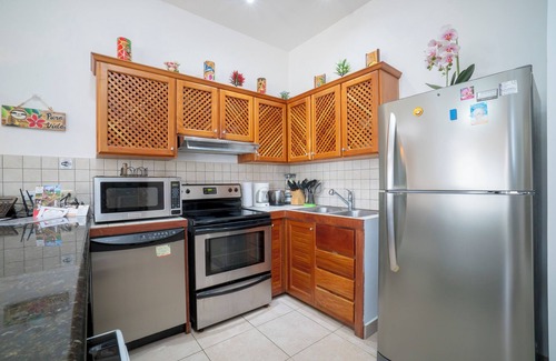 Cerro Plano Condominio | Beautiful Condo garden and pool views, a few steps from Jaco Beach