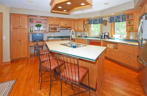 Empire Casa | Beautiful home on Little Glen Lake with a pool table, dock, fireplace, AC