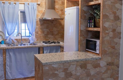 Almodovar del Río Chalet De Esquí | Beautiful house with natural caves and salt water pool