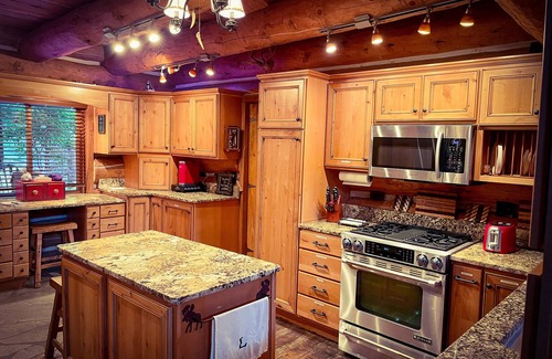 Coeur d'Alene Casa | Beautiful Log Cabin w/ Beachfront & Stunning Lake Views in Coeur d'Alene Idaho.