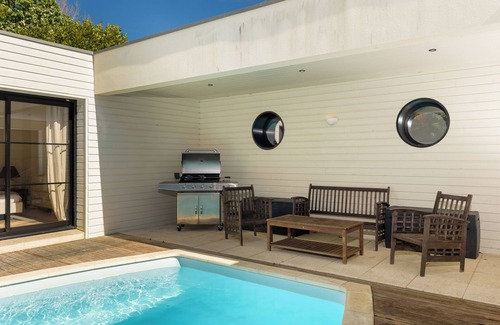 Plomeur Villa | Beautiful renovation of a farmhouse with modern extension, overlooking a swimming pool.
