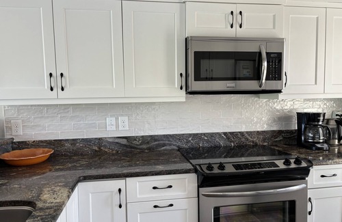 Spinnaker Beachhouses Villa | ¡Renovación completa de 2019! ¡Maravilloso! A pie de playa, piscinas, golf, tarjetas de servicios.