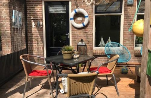 Anjum Casa | BelleMare Bungalow Lauwersmeer mit überdachte Veranda und eingezäuntem Garten