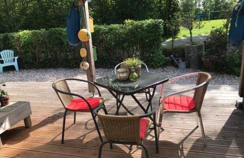 Anjum Casa | BelleMare Bungalow Lauwersmeer mit überdachte Veranda und eingezäuntem Garten