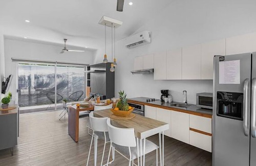 Barrio Ricos y Famosos Condominio | Best vacation rental to enjoy. Close to Beach and Town. Fully equipped Condo.