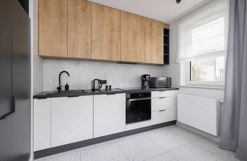 Grzegorzki Apartamento | Black and Grey Apartment by Renters