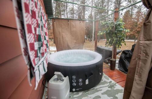 Necedah Casa | Black bear cabin with blow up hot tub